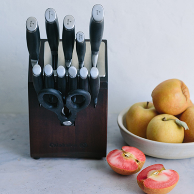 Cutlery set sitting on counter next to fruit
